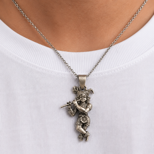 925 silver Lord Krishna flute pendant worn on a chain over a white shirt