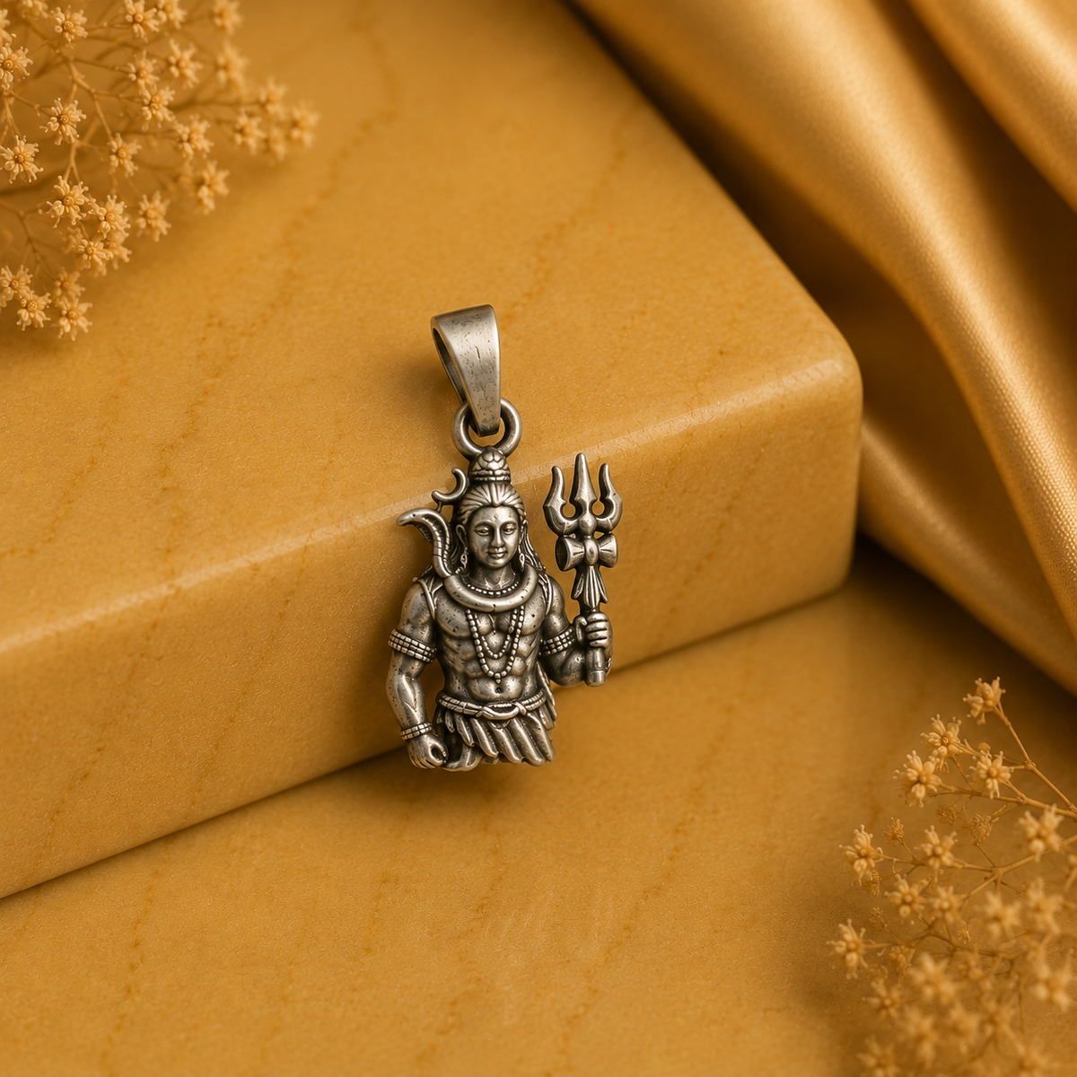 925 silver Lord Shiva trishul pendant on loop bail, shown close-up on golden fabric