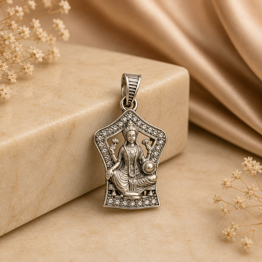 925 silver Maa Lakshmi lotus temple pendant with clear stone frame, front view on beige surface