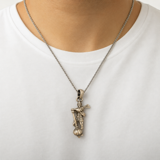925 silver Mahabali Bhim gada pendant on a chain worn on a white shirt