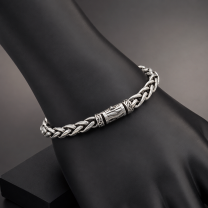 925 silver men’s braided bracelet worn on black display stand with engraved center links
