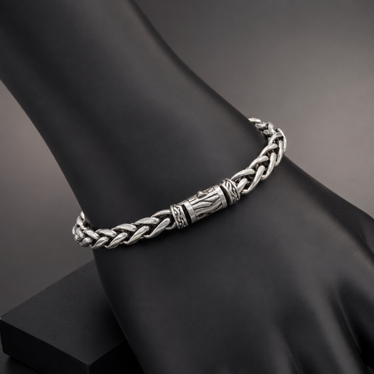 925 silver men’s braided bracelet worn on black display stand with engraved center links