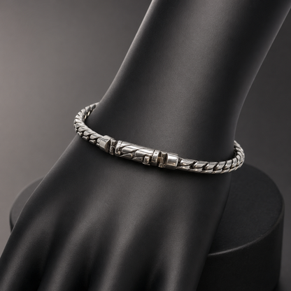925 silver men’s twisted-link bracelet shown on a black display stand