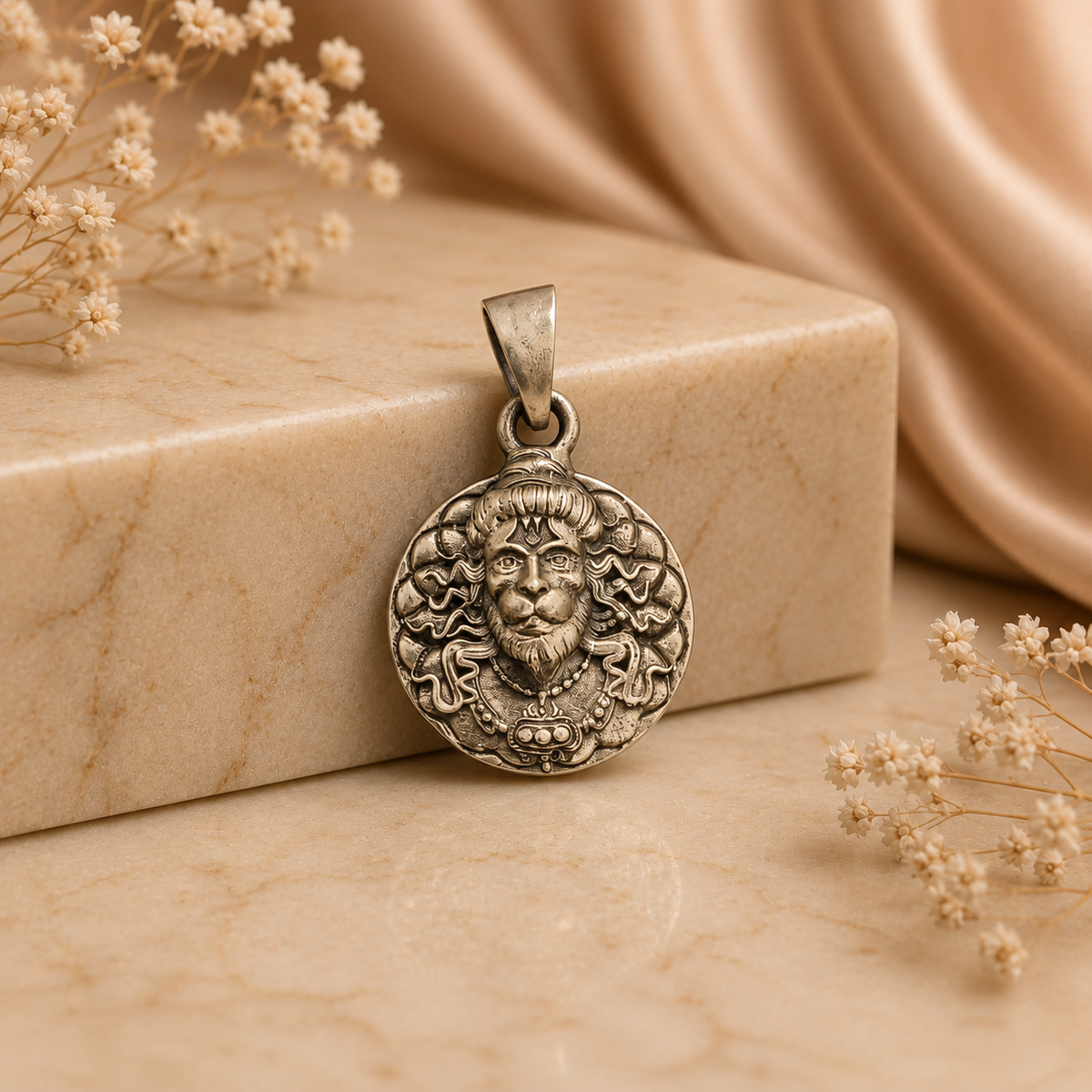 925 silver Lord Narasimha face pendant with bail, close-up on beige background