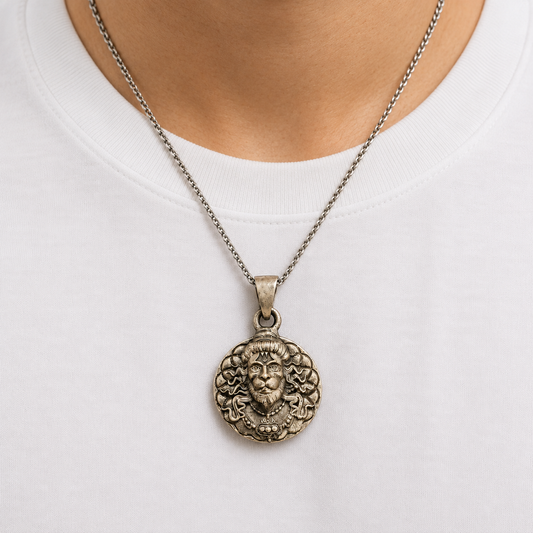 925 silver Lord Narasimha face pendant on a chain worn on white shirt