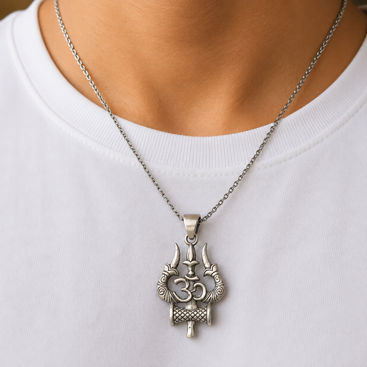 925 silver Om Trishul Damru pendant worn on a silver chain on a white shirt
