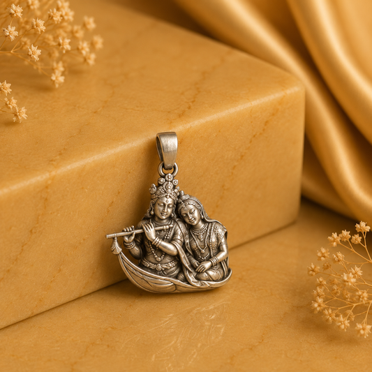 925 silver Radha Krishna flute pendant with two deity figures in a round base