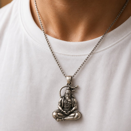 Rishi muni pendant in 925 silver worn on a chain necklace against a white shirt