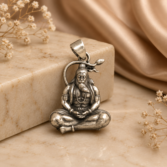 925 silver rishi muni pendant with seated sage figure on stone background