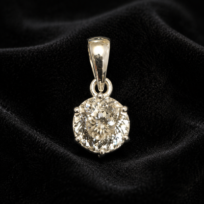 Round cubic zirconia pendant set in 925 silver, shown front view on black velvet