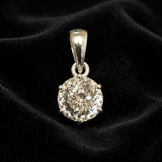 Round cubic zirconia pendant set in 925 silver, shown front view on black velvet