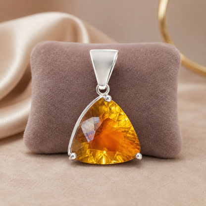 925 silver trillion-cut citrine pendant centerpiece on display over velvet