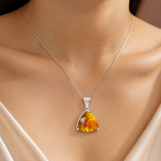 925 silver trillion-cut citrine pendant on chain, worn close-up with satin backdrop