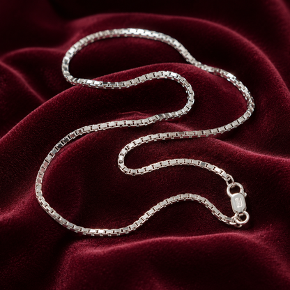 Short 925 sterling silver box chain necklace with clasp on burgundy velvet