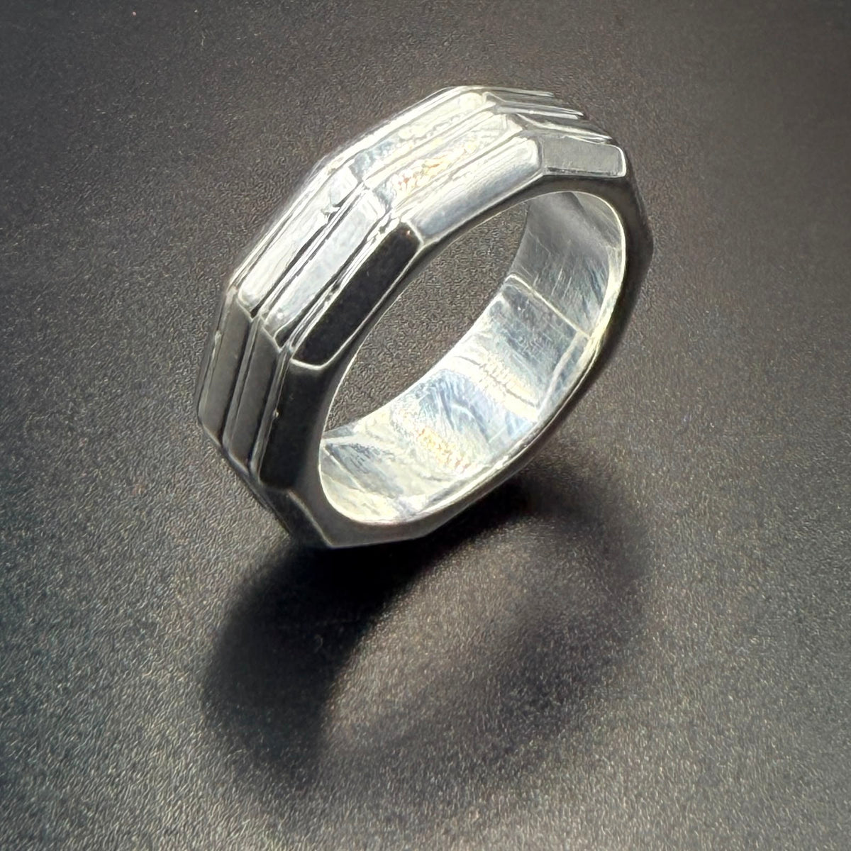 925 sterling silver geometric wide band ring with layered angular ridge design, high-polish finish