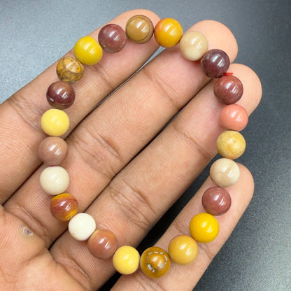Australian Mookaite Bracelet Grounding Strength Stone with round multicolored beads on hand