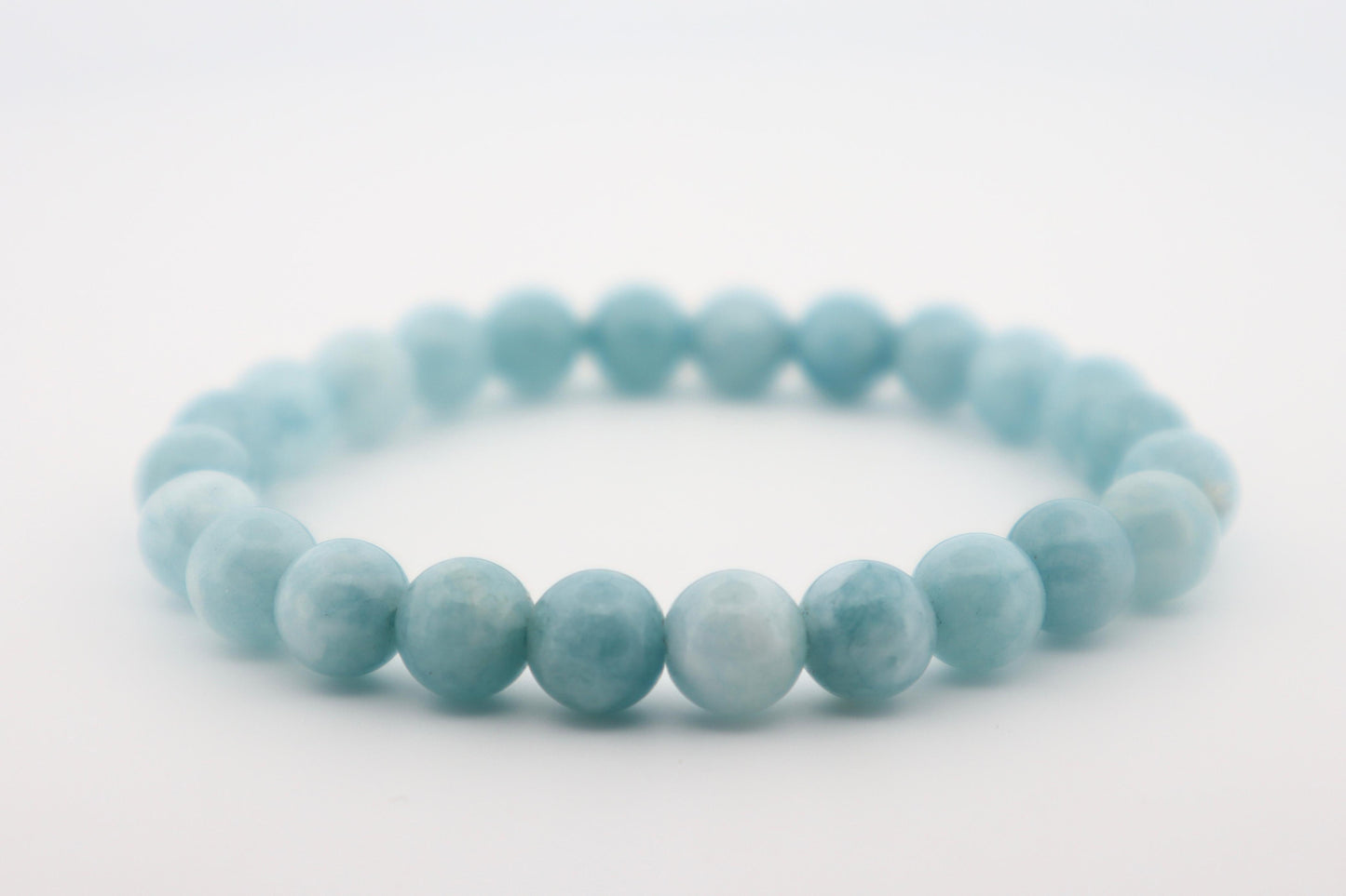 Light blue beaded bracelet on a white background