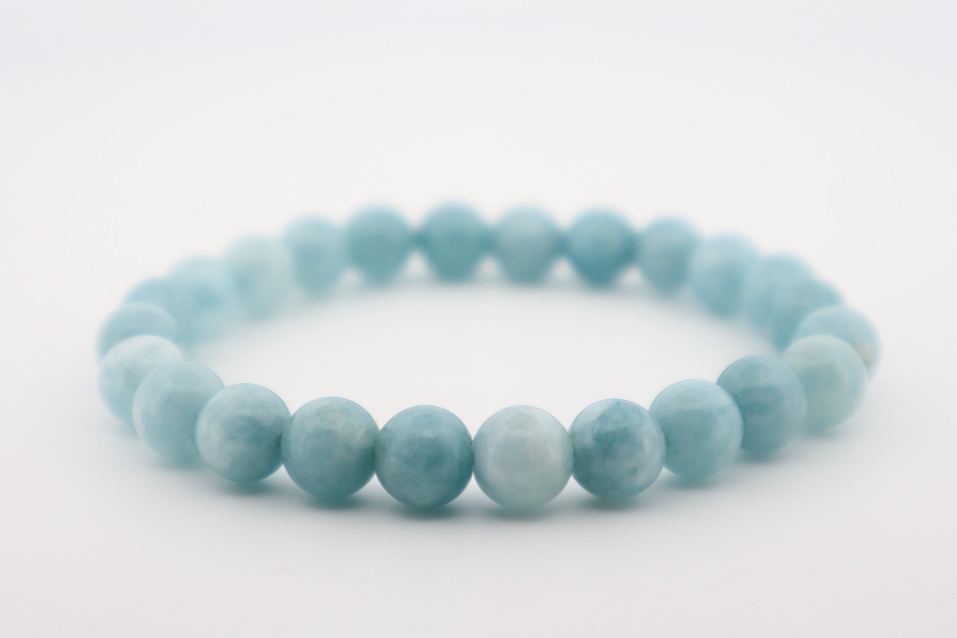 Light blue beaded bracelet on a white background