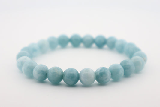 Light blue beaded bracelet on a white background