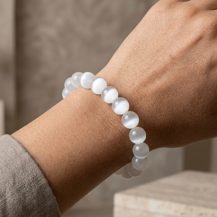 Natural Selenite gemstone bracelet with a soft luminous glow on a wrist