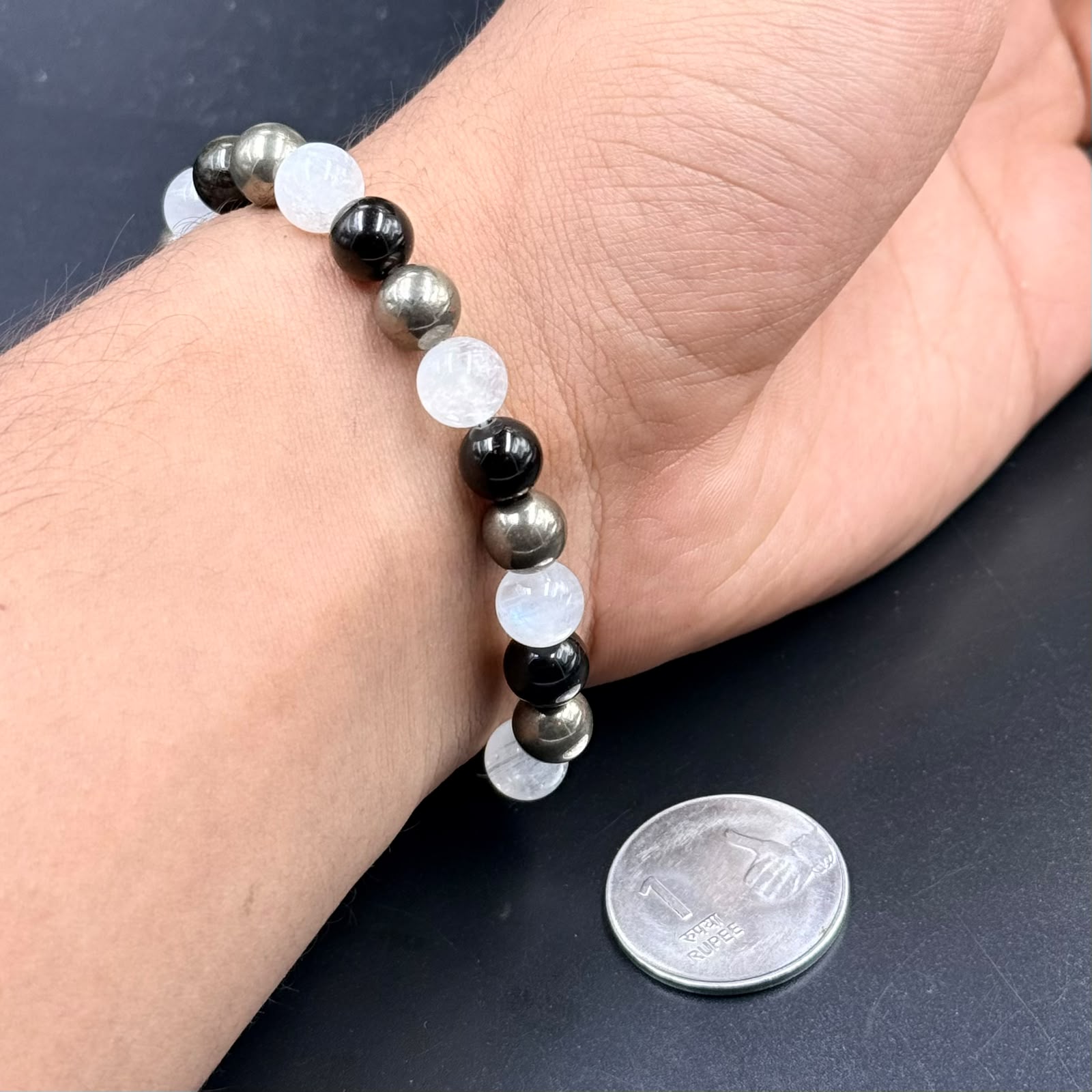 Abundance Shield & Intuition bracelet on hand with moonstone and dark golden sheen beads