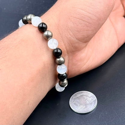 Abundance Shield & Intuition bracelet on hand with moonstone and dark golden sheen beads