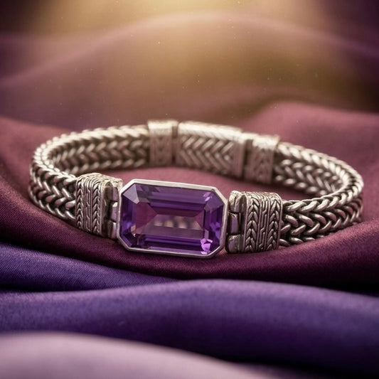 Amethyst 925 silver bracelet with faceted purple amethyst stone on purple satin