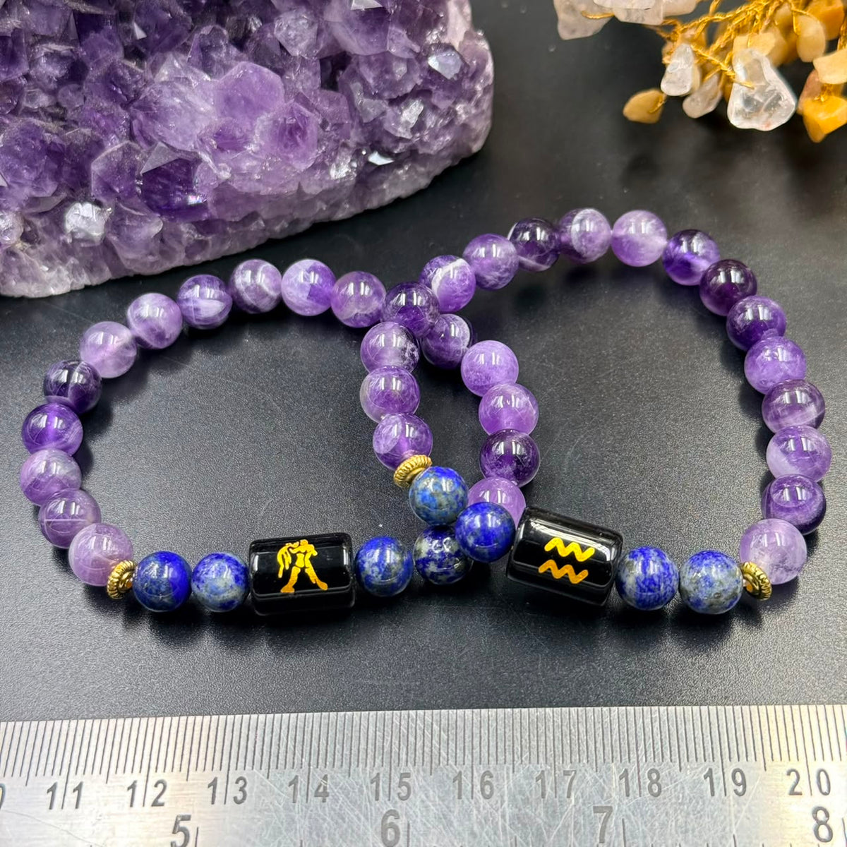 Aquarius zodiac bracelet design with amethyst and lapis lazuli beads with black sign charm