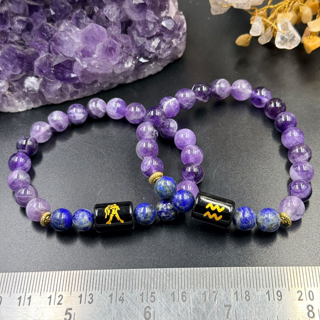 Aquarius zodiac bracelet design with amethyst and lapis lazuli beads with black sign charm