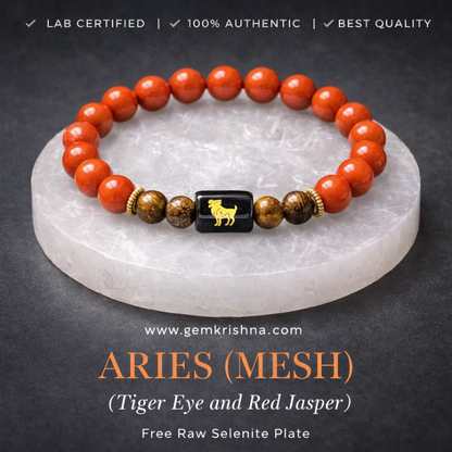 Aries zodiac bracelet with red jasper and tiger eye beads on a selenite plate
