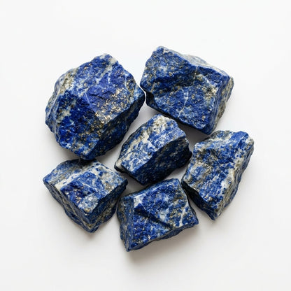 Assorted raw lapis lazuli crystal pieces with blue color and golden speckles