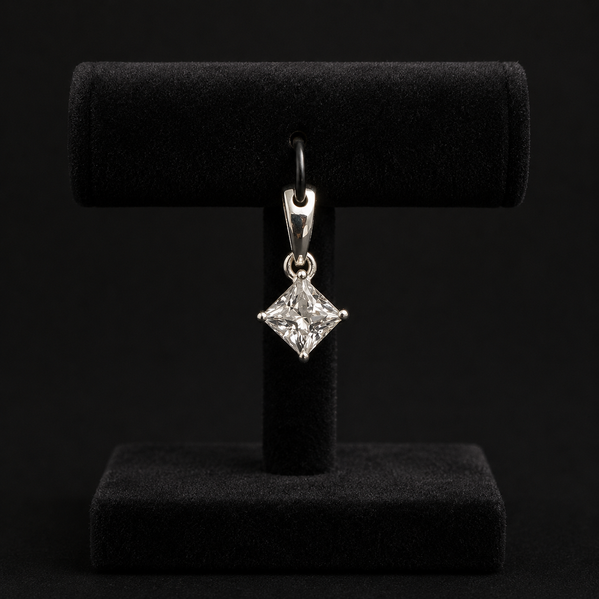 Back view of 925 silver moissanite princess cut solitaire pendant on a black jewelry stand