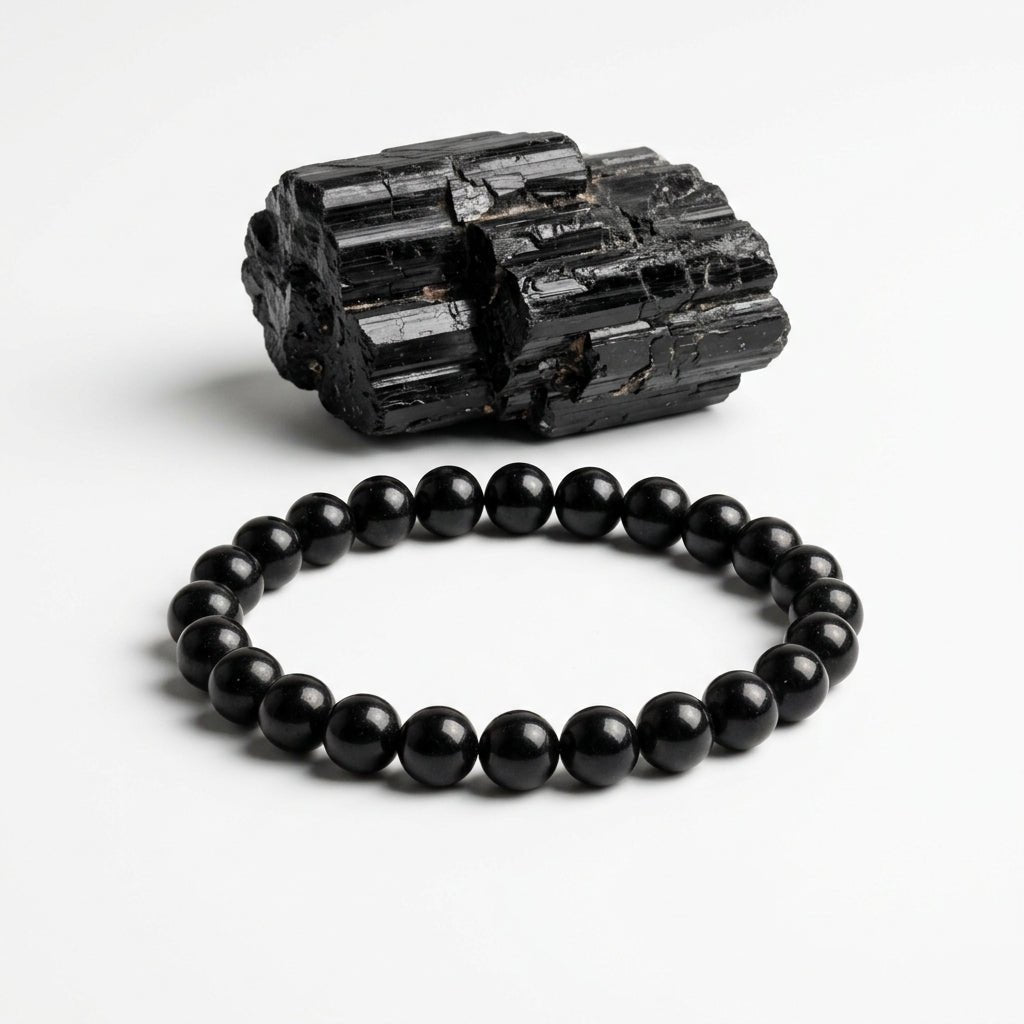 Natural black tourmaline bead bracelet with round black stones and rough black tourmaline specimen
