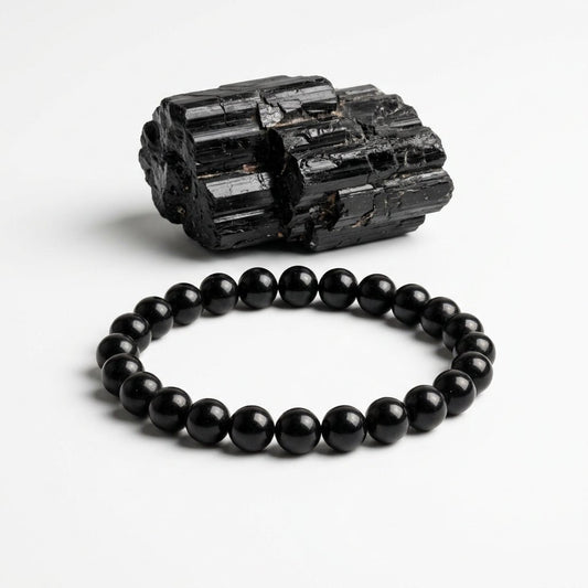 Natural black tourmaline bead bracelet with round black stones and rough black tourmaline specimen