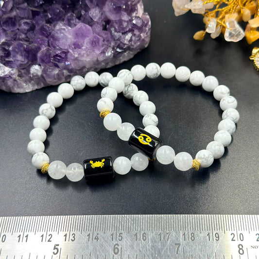 Cancer (Karka) zodiac bracelet view with milky quartz beads and black enamel crab charm