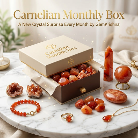 Carnelian Monthly Box gift with carnelian crystals, bracelet, and jewelry on marble