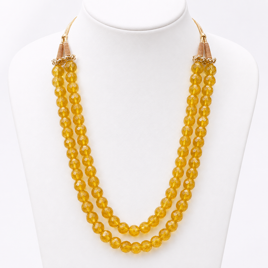 Citrine faceted two-line mala necklace with gold cord tassel closure on white bust