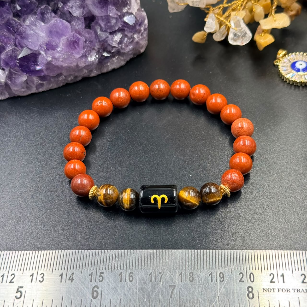 Close view of Aries (Mesh) zodiac bracelet with red jasper beads and tiger eye accents