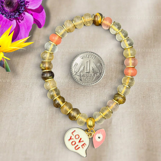 Crystal Love You bracelet with gold-toned beads and small heart charm