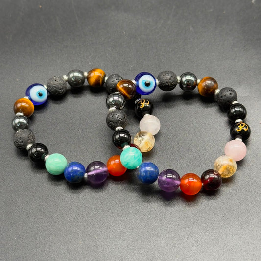 Divine Shield multi-gemstone beaded bracelet featuring evil eye bead, Om charm, and chakra colors