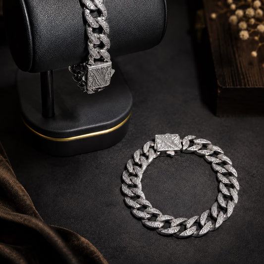 Engraved curb link 925 sterling silver bracelet for men, shown on a black display stand