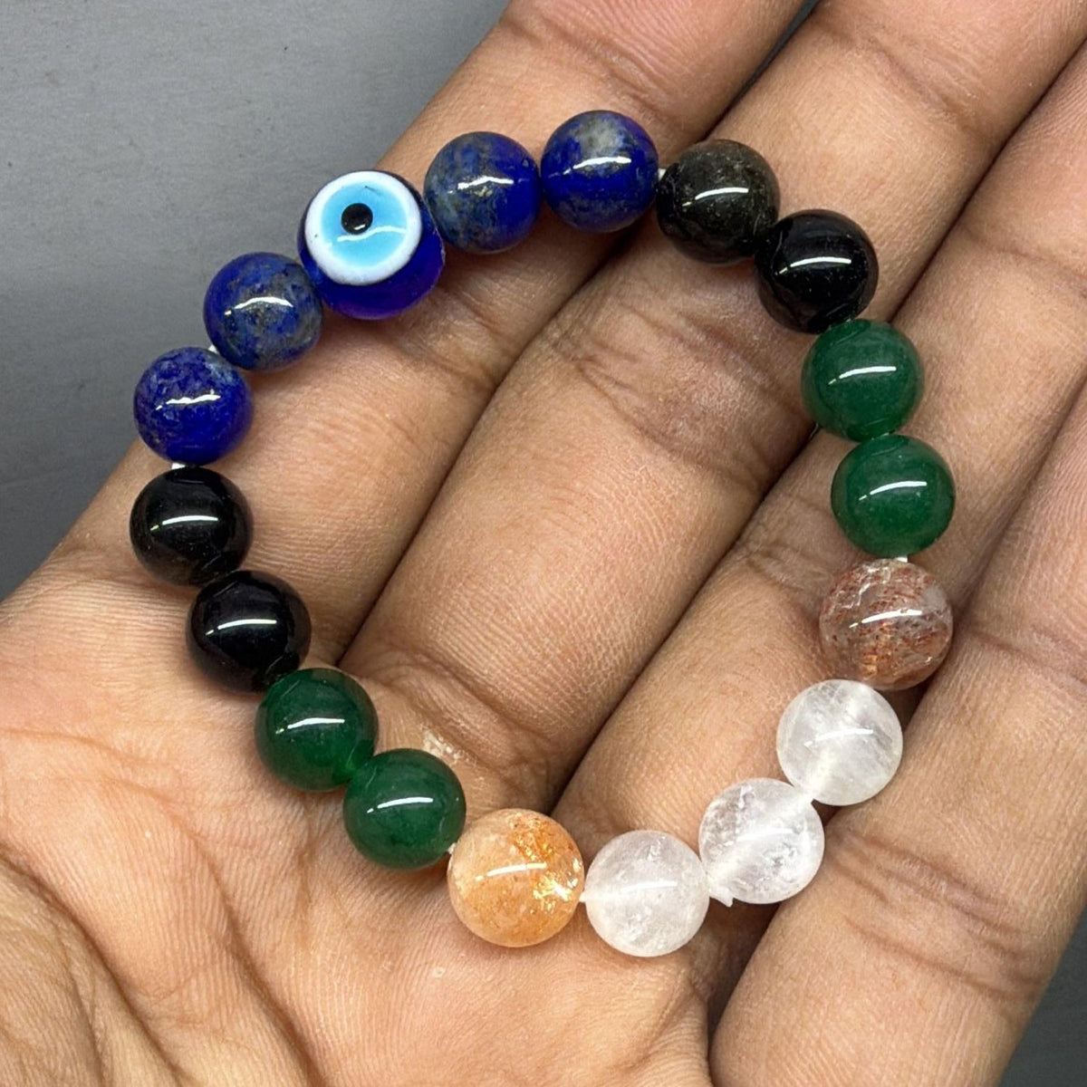 evil eye black tourmaline lapis lazuli green jade sunstone and clear quartz custom bracelet by gemkrishna