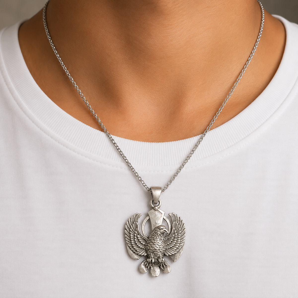 Garuda dev eagle 925 silver pendant worn on a chain against a white shirt