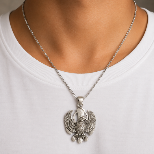 Garuda dev eagle 925 silver pendant worn on a chain against a white shirt