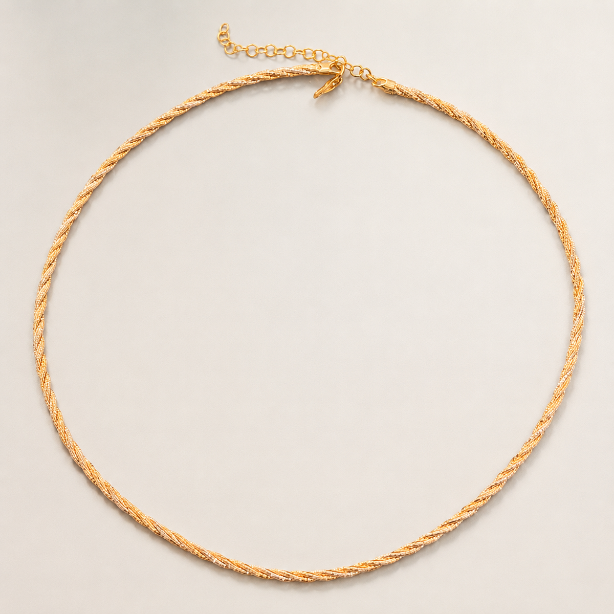13 gram gold and silver mix Italian hasli necklace with clasp laid flat on background