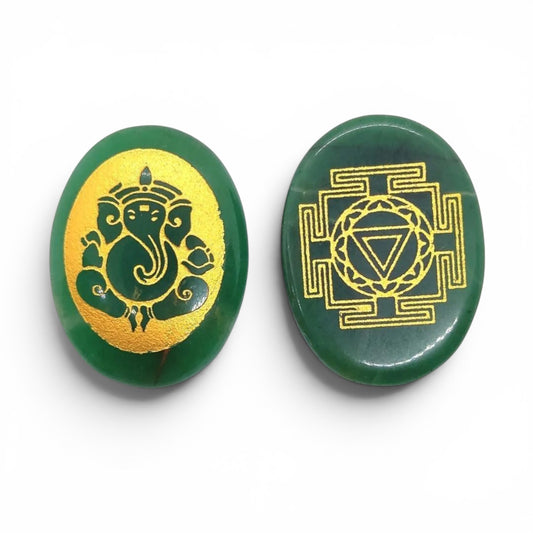 Green jade palm stone pair with gold Ganesh ji designs in close-up view