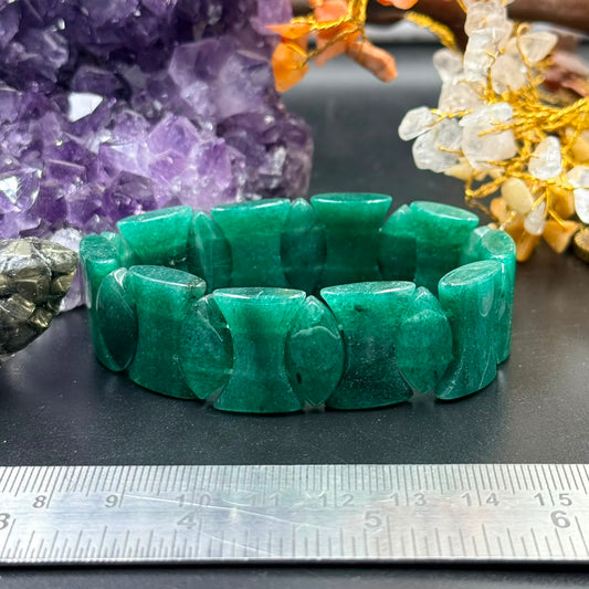 Green jade curved hourglass bead bracelet in stacked bead design with ruler for scale