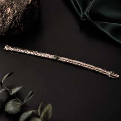 Green stone snake scale 925 sterling silver bracelet with clasp, close-up on dark background