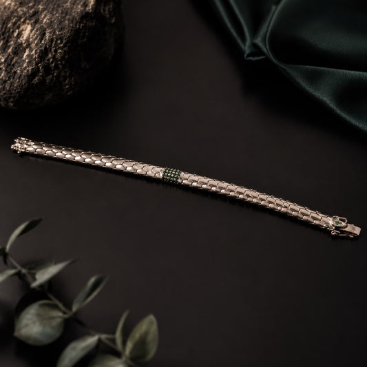 Green stone snake scale 925 sterling silver bracelet with clasp, close-up on dark background