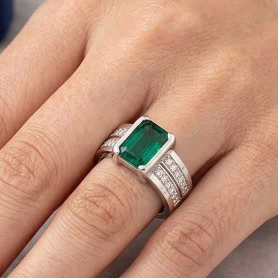 Silver emerald green panna ring on hand with pavé accents on the band
